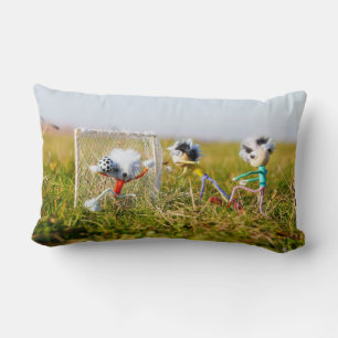 The playful Fubby's playing soccer. Pillows