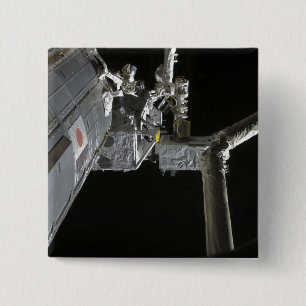 The robotic arm of the Japanese Experiment Modu 2 Inch Square Button