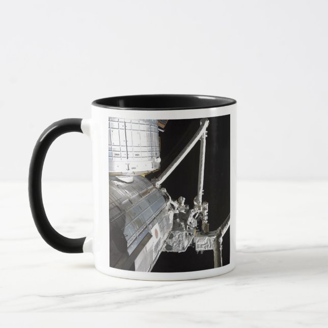 The robotic arm of the Japanese Experiment Modu 2 Mug (Left)