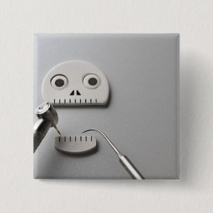 The skeleton which dental treatment is taken 2 inch square button