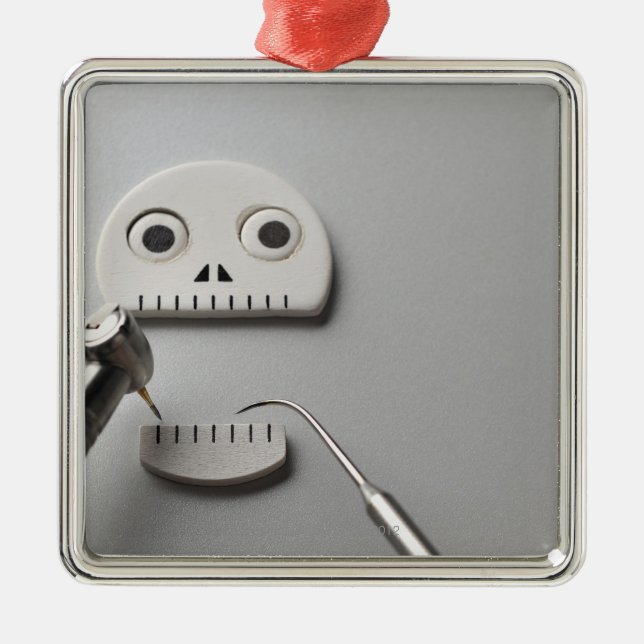 The skeleton which dental treatment is taken metal ornament (Front)