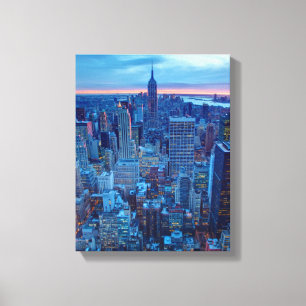 The skyscrapers of Manhattan are lit Canvas Print