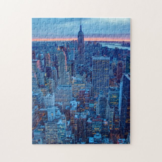 The skyscrapers of Manhattan are lit Jigsaw Puzzle (Vertical)