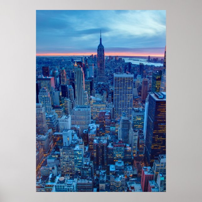 The skyscrapers of Manhattan are lit Poster (Front)