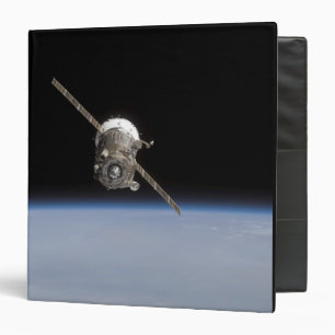 The Soyuz TMA-11 spacecraft above Earth's horiz Binder