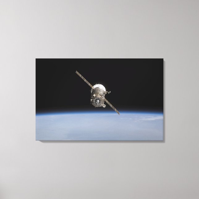 The Soyuz TMA-11 spacecraft above Earth's horiz Canvas Print (Front)