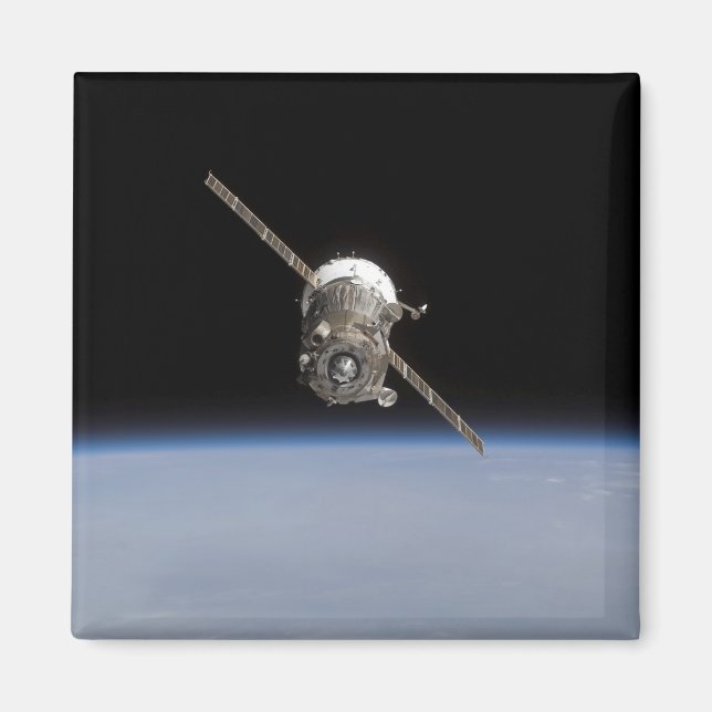 The Soyuz TMA-11 spacecraft above Earth's horiz Magnet (Front)