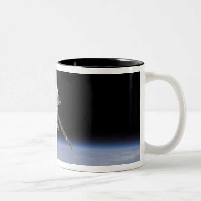 The Soyuz TMA-11 spacecraft above Earth's horiz Two-Tone Coffee Mug (Right)