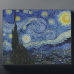 The Starry Night Plaque<br><div class="desc">The Starry Night by Vincent van Gogh The Starry Night is a painting by Dutch post-impressionist artist Vincent van Gogh. The painting depicts the view outside his sanitarium room window at night, although it was painted from memory during the day. The centre part shows the village of Saint-Rémy under a...</div>