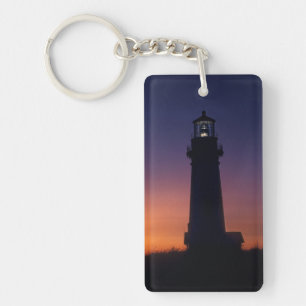 The sun ball drops down on the colourful horizon keychain