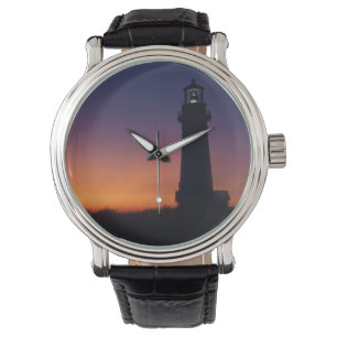 The sun ball drops down on the colourful horizon watch