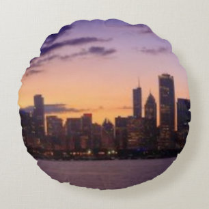 The sun sets over the Chicago skyline Round Pillow