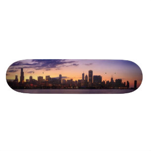 The sun sets over the Chicago skyline Skateboard