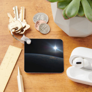 The Sun Setting Over Earth's Horizon. Keychain