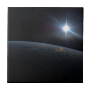 The Sun Setting Over Earth's Horizon. Tile