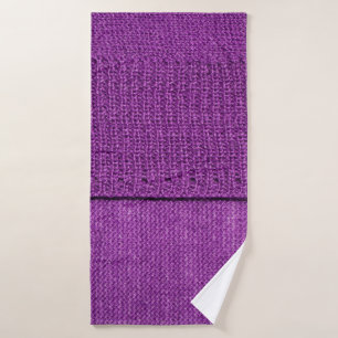 the texture of the knitted fabric, a plain purple  bath towel