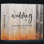 The Two Lovers Carved Trees Wedding Photo Album Binder<br><div class="desc">The Two Lovers Carved Trees Fall Forest Design with soft pretty wilderness photography image. A rustic outdoor landscape scene for an adventurous lodge, mountain, retreat wedding, in orange, yellow golds, greys, brown and white. Featuring 2 oak trees with hearts and couple's initial letters carved into them surrounded by a birch...</div>