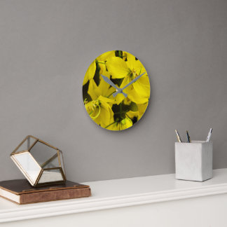 The yellow of laburnum flowers round clock