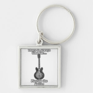 There is always time for playing the guitar. B&W Keychain