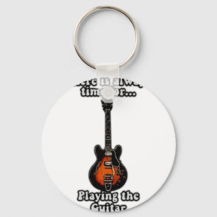 There is always time for playing the guitar. retro keychain