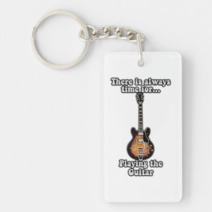 There is always time for playing the guitar. retro keychain