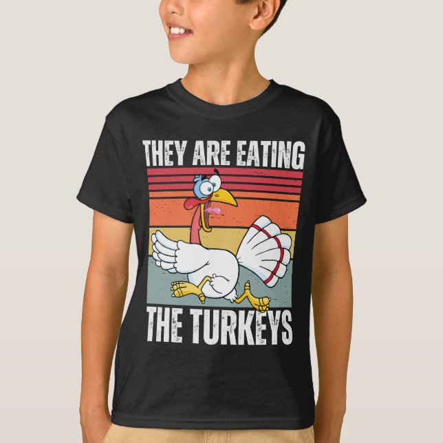 They're Eating The Turkeys Funny Thanksgiving T-Shirt (Front)