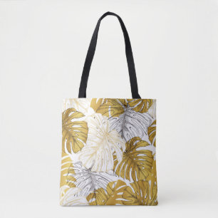 Thickets from a monstera plant. Image of golden an Tote Bag