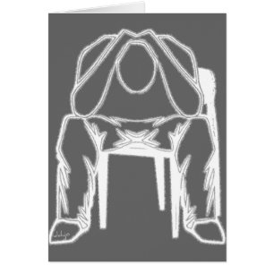Thinking Man sitting in chair holding his head.