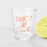 THIRTY AF Personalized Funny 30th Birthday Shot Glass<br><div class="desc">Kick off turning 30 with a toast you won’t forget. This bold “THIRTY AF” shot glass features vibrant orange text and your custom name in a chic script font — the perfect combo of playful and personal. Ideal for birthday parties, brunches, bachelorette weekends, or gifting your bestie something she’ll actually...</div>