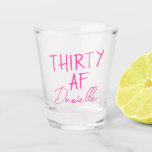 THIRTY AF Personalized Funny 30th Birthday Shot Glass<br><div class="desc">Kick off turning 30 with a toast you won’t forget. This bold “THIRTY AF” shot glass features vibrant pink text and your custom name in a chic script font — the perfect combo of playful and personal. Ideal for birthday parties, brunches, bachelorette weekends, or gifting your bestie something she’ll actually...</div>