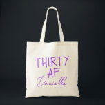 THIRTY AF Personalized Funny 30th Birthday Tote Bag<br><div class="desc">This personalized “THIRTY AF” tote bag is the ultimate 30th birthday accessory — bold, fun, and fabulously functional. Featuring a custom name in elegant vibrant purple script beneath the playful slogan, it’s perfect for brunches, gifting, errands, or that post-party coffee run. Made for birthdays with attitude, this bag is as...</div>