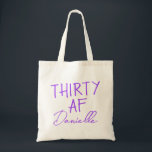THIRTY AF Personalized Funny 30th Birthday Tote Bag<br><div class="desc">This personalized “THIRTY AF” tote bag is the ultimate 30th birthday accessory — bold, fun, and fabulously functional. Featuring a custom name in elegant vibrant purple script beneath the playful slogan, it’s perfect for brunches, gifting, errands, or that post-party coffee run. Made for birthdays with attitude, this bag is as...</div>