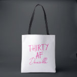 THIRTY AF Personalized Funny 30th Birthday Tote Bag<br><div class="desc">Celebrate turning 30 in bold style with this personalized “THIRTY AF” tote bag. Featuring vibrant pink text and your custom name in elegant script, this playful yet practical bag is perfect for birthday brunches, party essentials, or gift-giving flair. Whether you’re treating yourself or surprising your bestie, this tote adds sass...</div>
