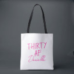 THIRTY AF Personalized Funny 30th Birthday Tote Bag<br><div class="desc">Celebrate turning 30 in bold style with this personalized “THIRTY AF” tote bag. Featuring vibrant pink text and your custom name in elegant script, this playful yet practical bag is perfect for birthday brunches, party essentials, or gift-giving flair. Whether you’re treating yourself or surprising your bestie, this tote adds sass...</div>