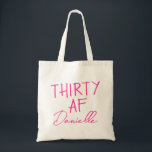 THIRTY AF Personalized Funny 30th Birthday Tote Bag<br><div class="desc">This personalized “THIRTY AF” tote bag is the ultimate 30th birthday accessory — bold, fun, and fabulously functional. Featuring a custom name in elegant vibrant pink script beneath the playful slogan, it’s perfect for brunches, gifting, errands, or that post-party coffee run. Made for birthdays with attitude, this bag is as...</div>