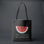 This is Not a Watermelon - Palestine watermelon  Tote Bag<br><div class="desc">After the six-day war in 1967, the Israeli government banned the Palestinian flag. The watermelon took its place due to it sharing the colours of the flag: red, black, white, and green. the fruit can be seen from the stone walls of Gaza to the galleries of Ramallah, hinting at the...</div>