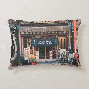 THREE BICYCLES PARKED IN FRONT OF BUILDING ACCENT PILLOW