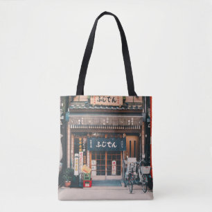 THREE BICYCLES PARKED IN FRONT OF BUILDING TOTE BAG