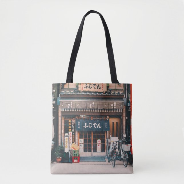 THREE BICYCLES PARKED IN FRONT OF BUILDING TOTE BAG (Front)