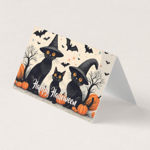 Three Black Cats with Hats on Halloween