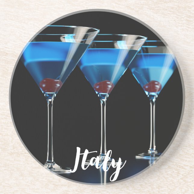 Three blue cocktails with cherry on black coaster (Front)
