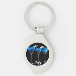 Three blue cocktails with cherry on black keychain