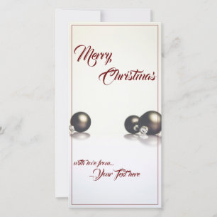 Three christmas balls in front of light background