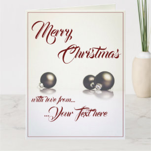 Three christmas balls in front of light background card