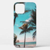 Three coconut trees on seashore