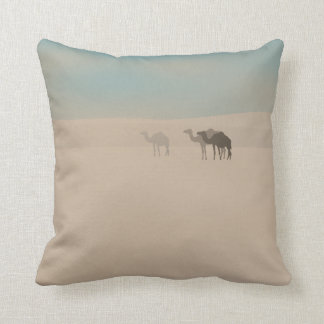 Three dromedary camels walking in Sahara desert Throw Pillow