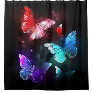 Three Glowing Butterflies on night background