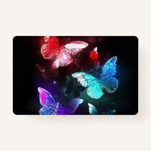 Three Glowing Butterflies on night background Badge