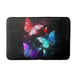 Three Glowing Butterflies on night background Bath Mat