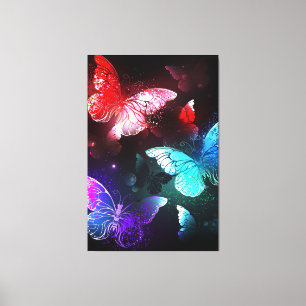 Three Glowing Butterflies on night background Canvas Print